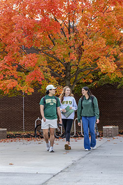 photo of students walking outside on campus