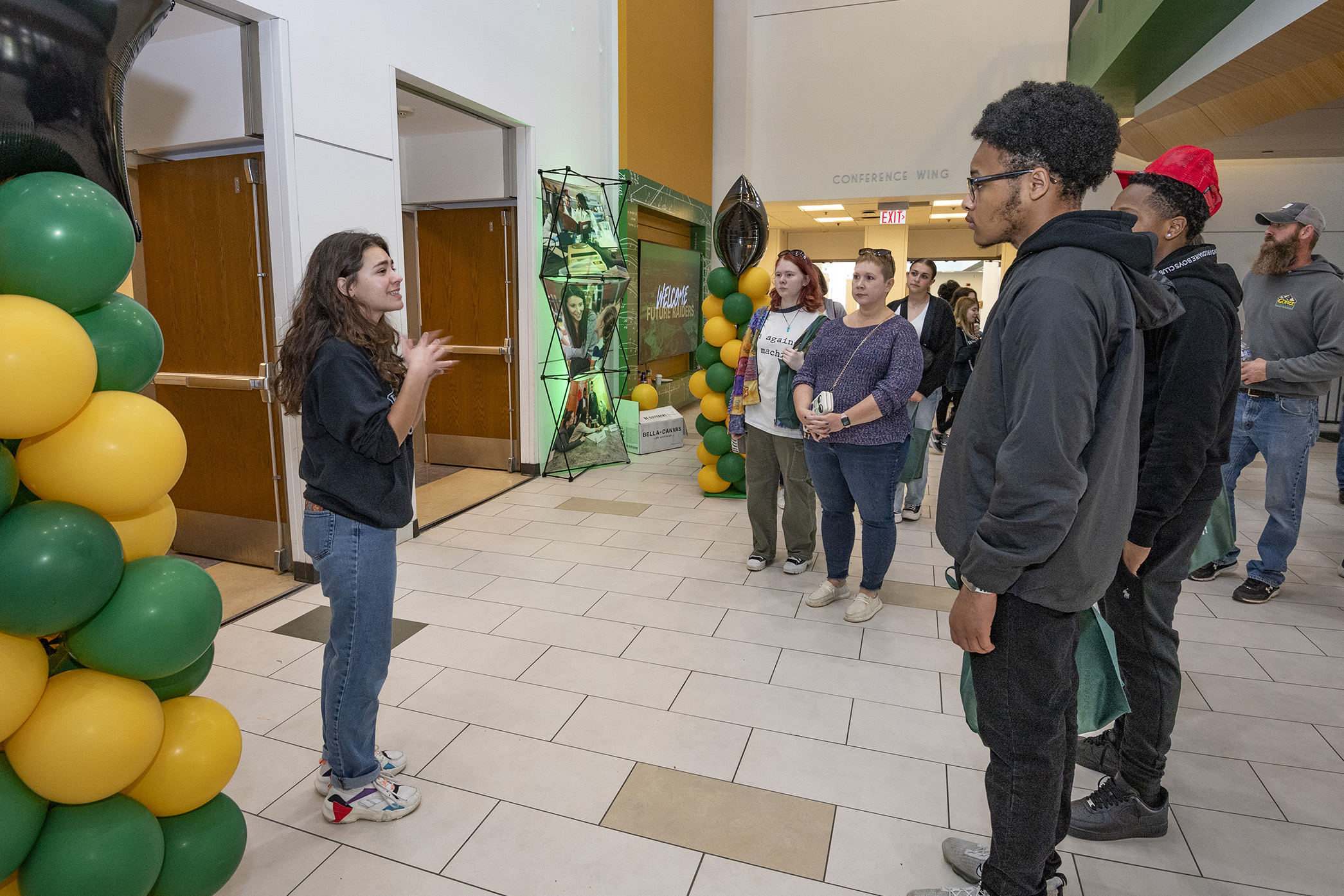 photo of a student leading prospective students and parents on a campus tour during raider open house