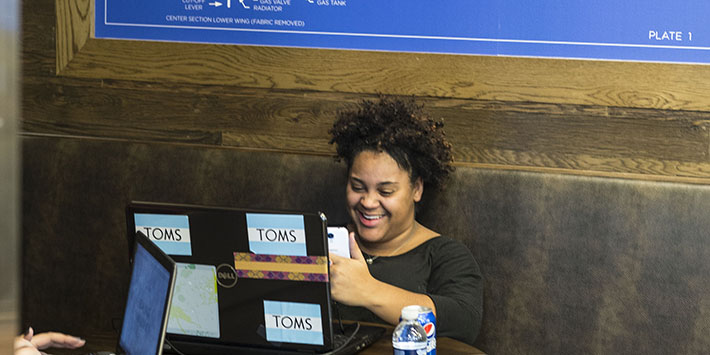 photo of the student sitting in the library dunbar cafe