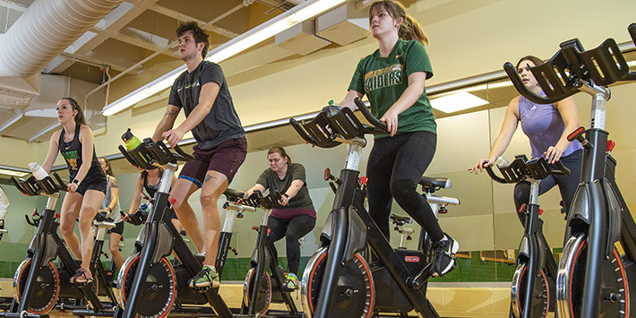 photo of students in a spinning class