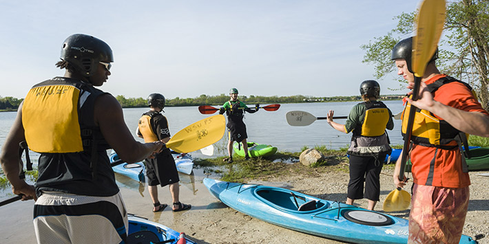 photo of students preparing to kayak