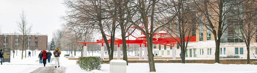 photo of people on campus on a snowy day