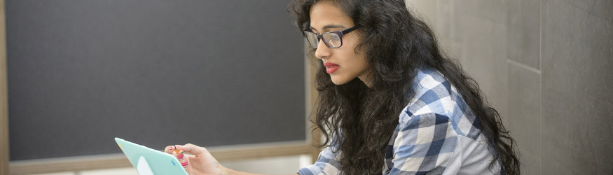 photo of a student looking at a laptop