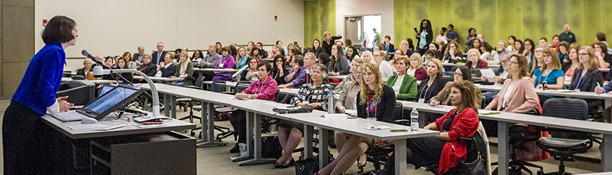 photo of students and a professor in class