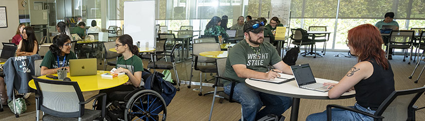 photo of students and tutors in the student success center