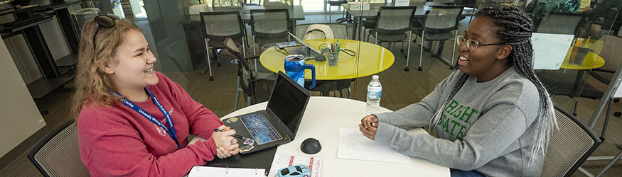 photo of students talking in the student success center