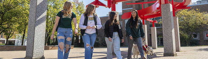 photo of students walking outside on campus