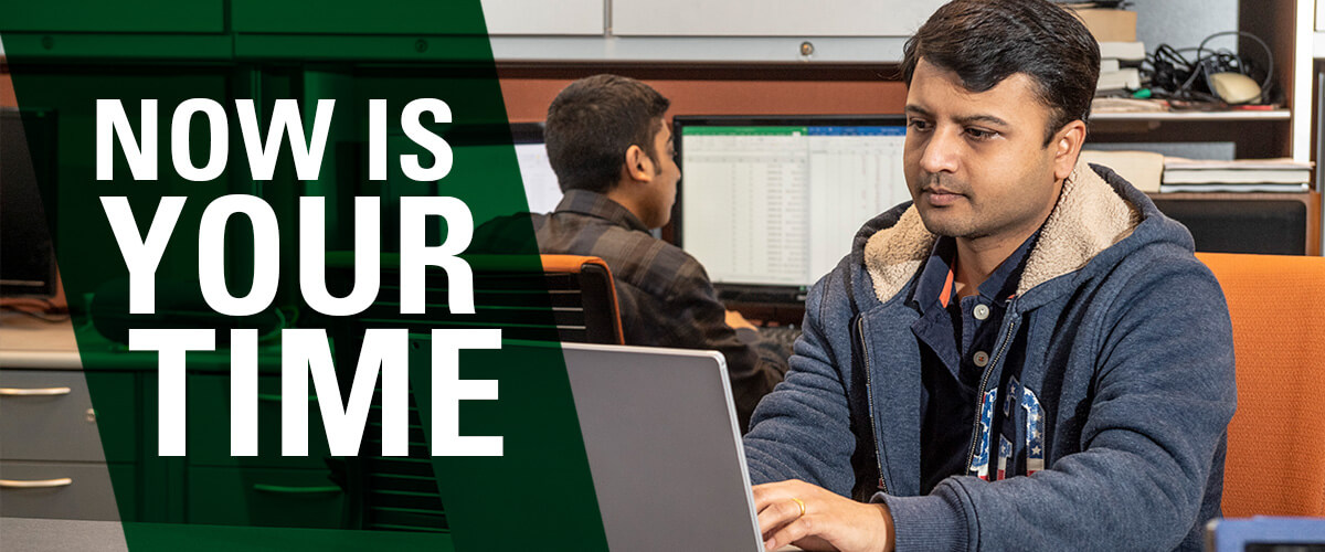 Students seated at computers and text "Now is your time"