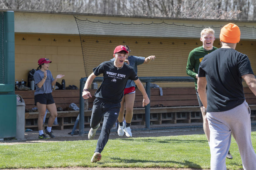 photo of students playing softball